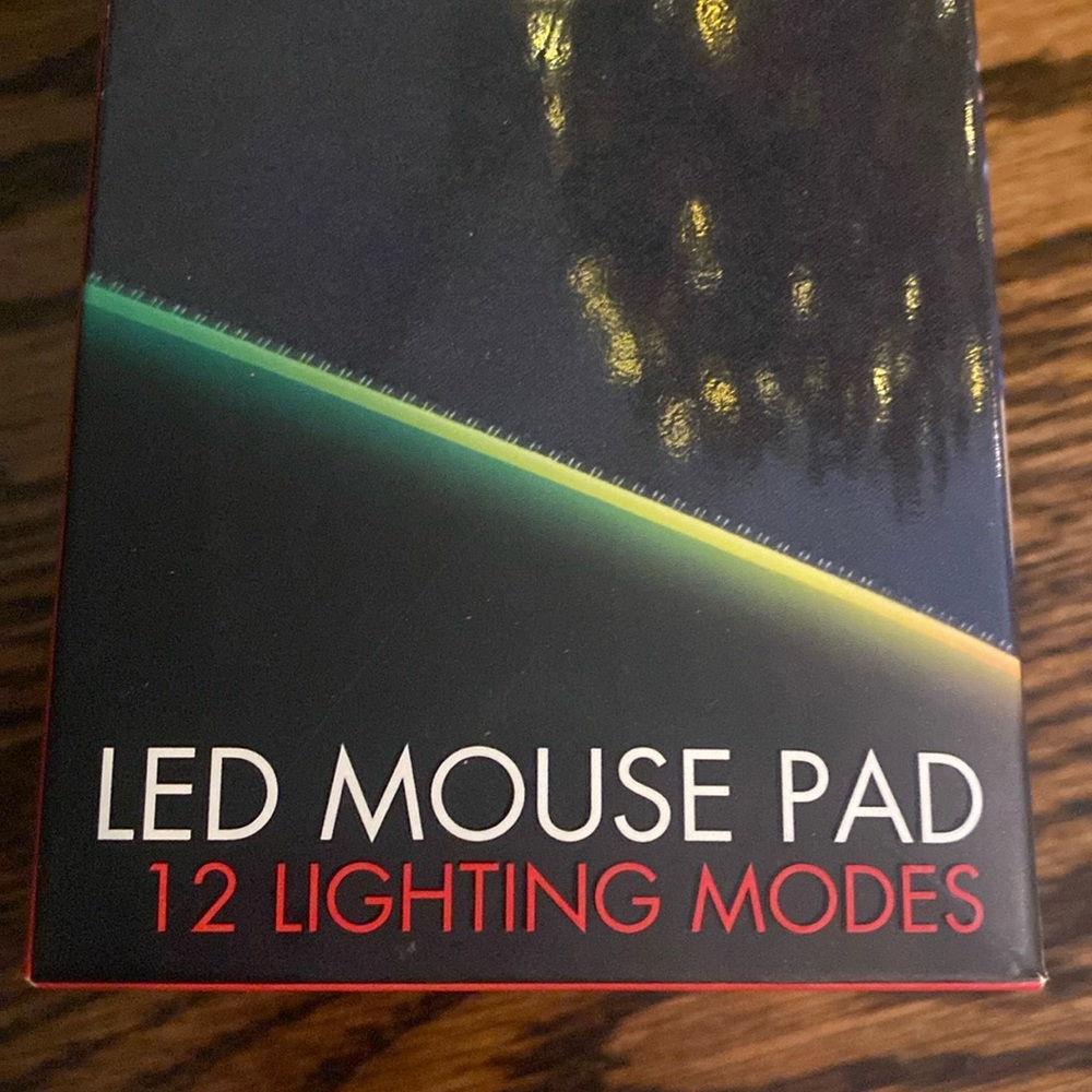 LED Mouse Pad with 12 different light modes 
 NWT
